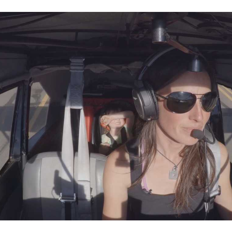 Image of woman in helicopter cockpit