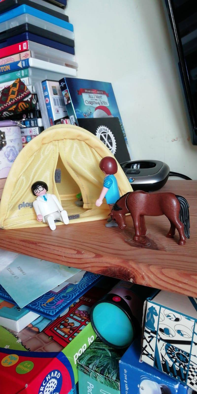 Playmobil toys by tent