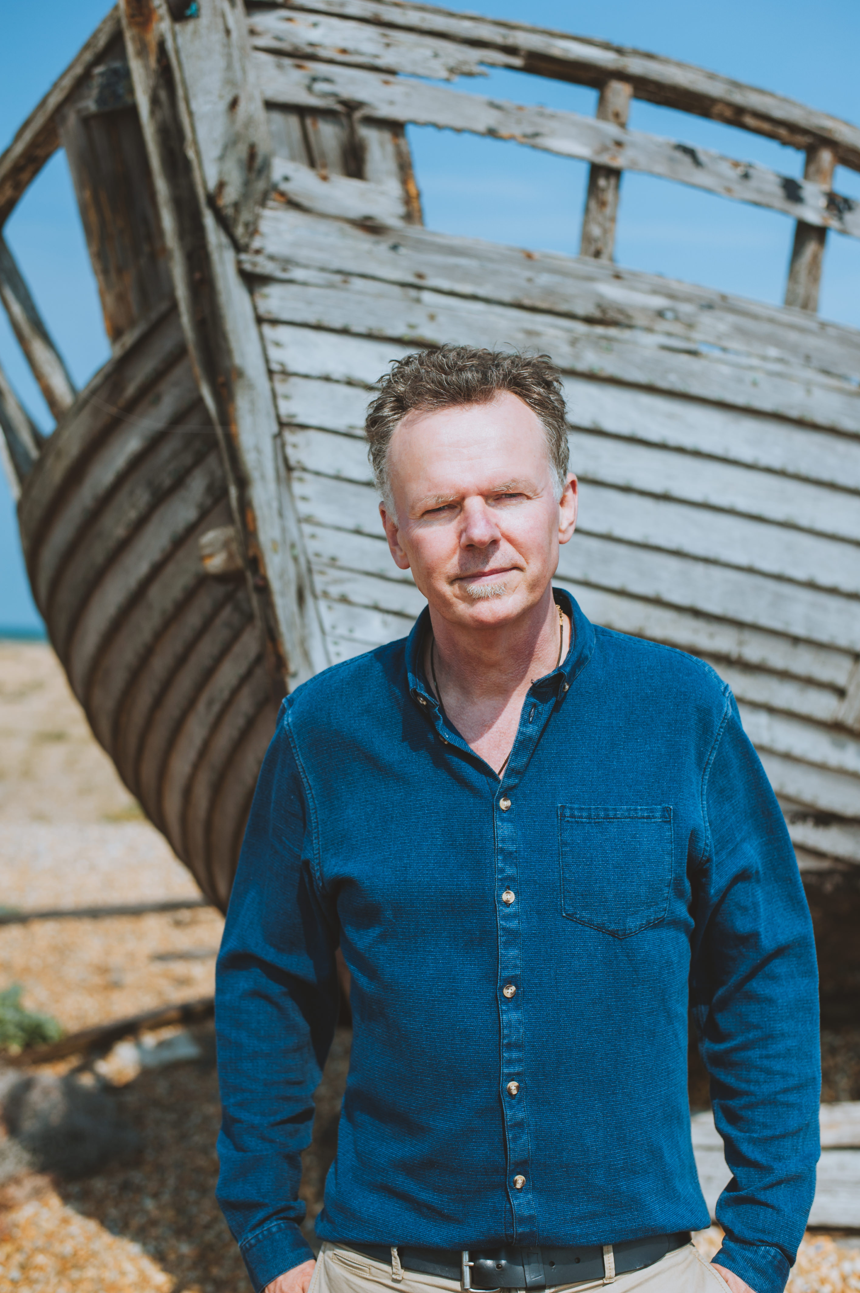 Image of William Shaw standing by a boat