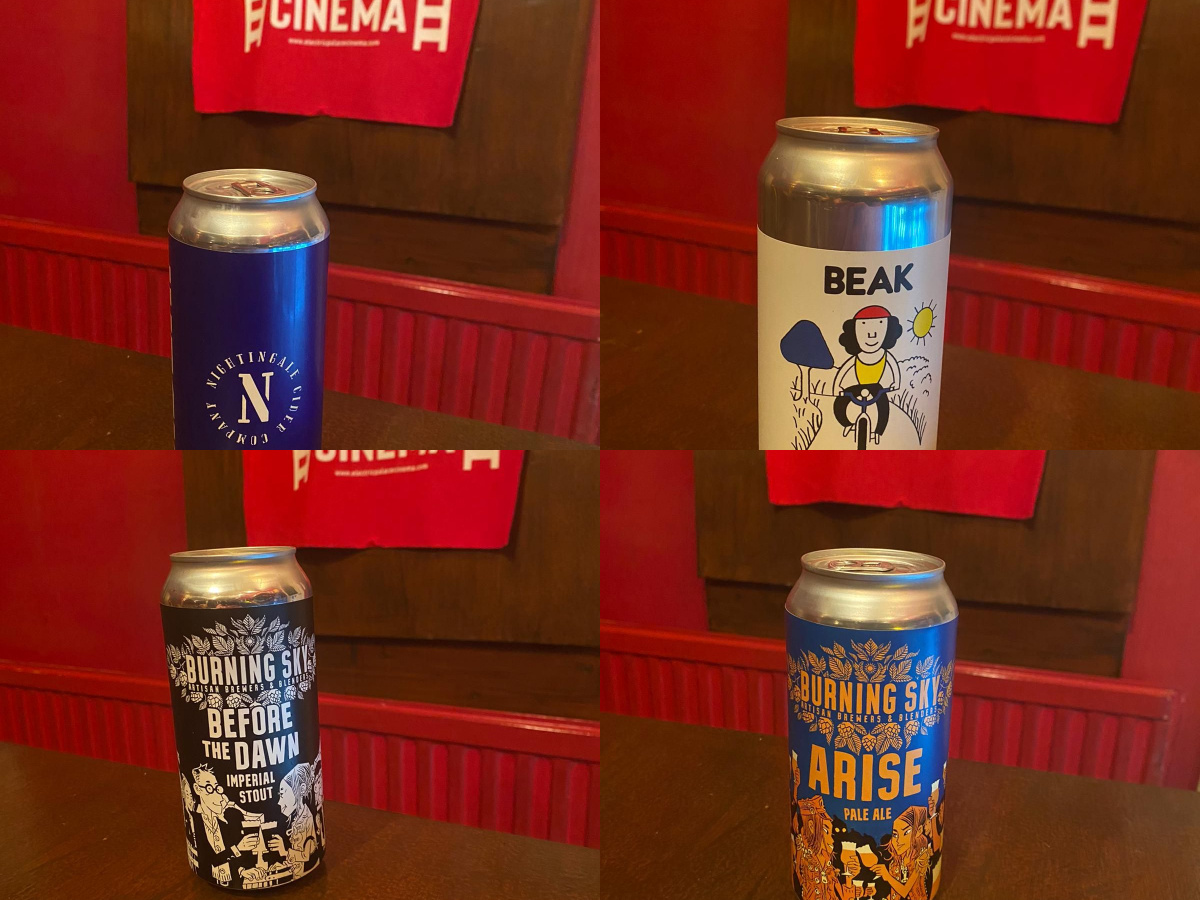 4 drinks cans photographed in front of Electric Palace bag