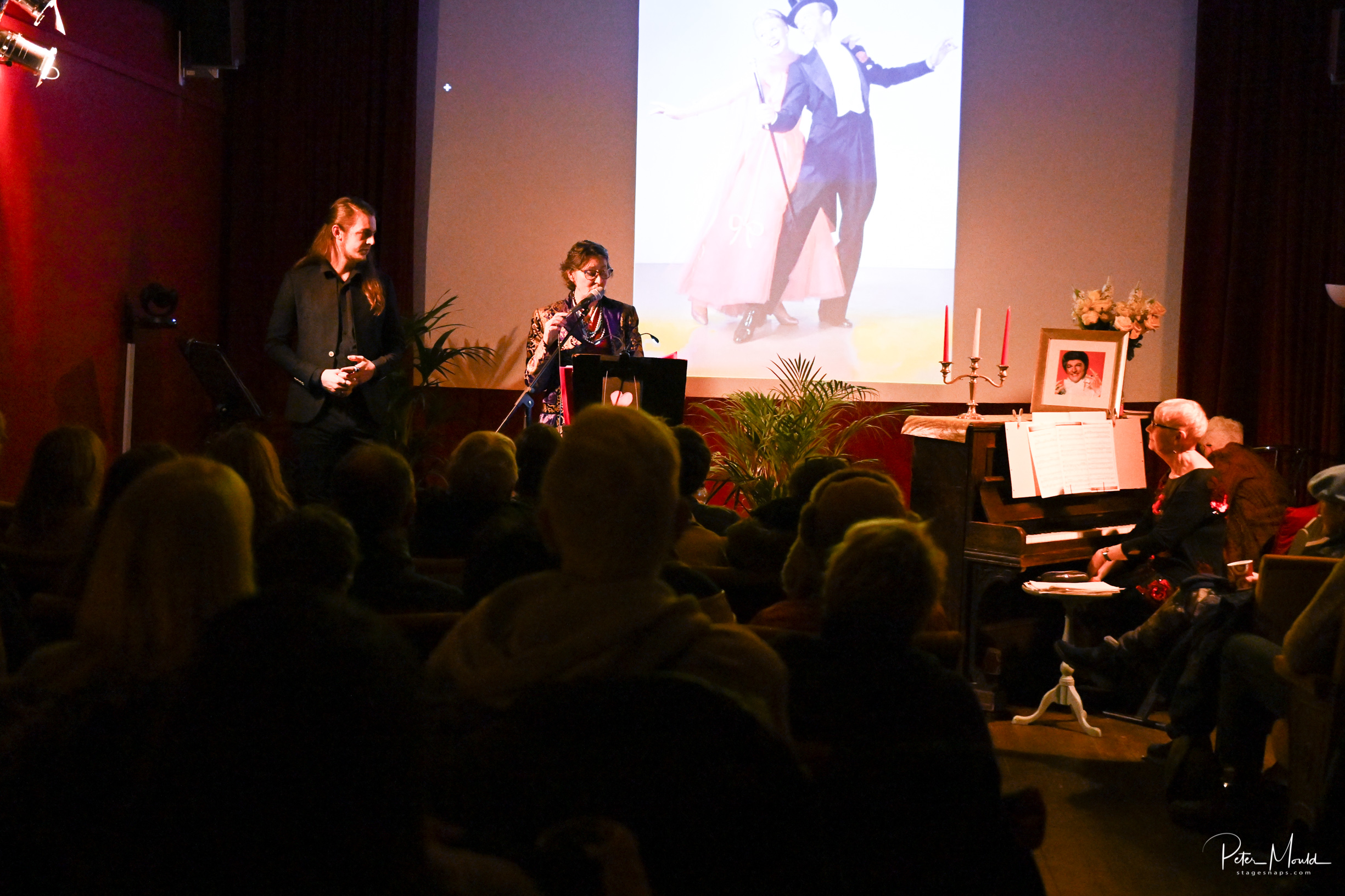 Group of people onstage and in audience at Electric Palace cinema