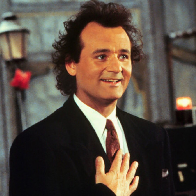 Bill Murray smiling in a black suit