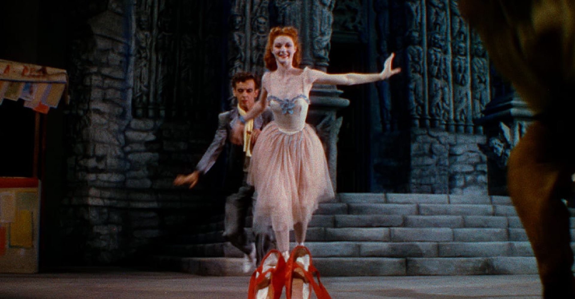Woman ballerina with red shoes