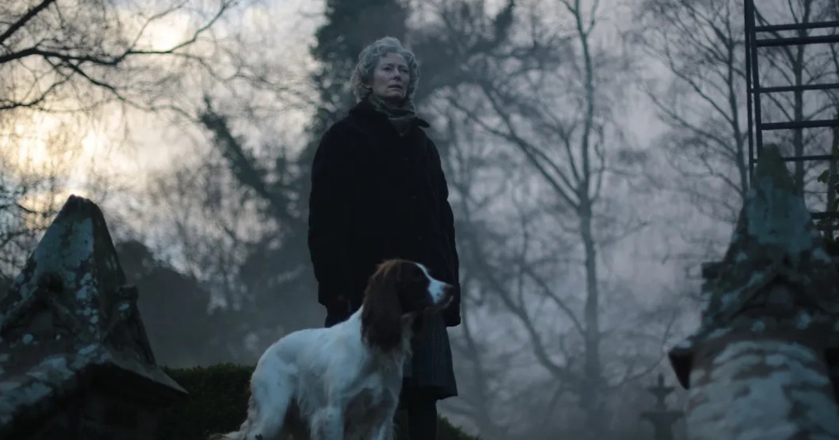 Tilda Swinton looks on over a misty garden